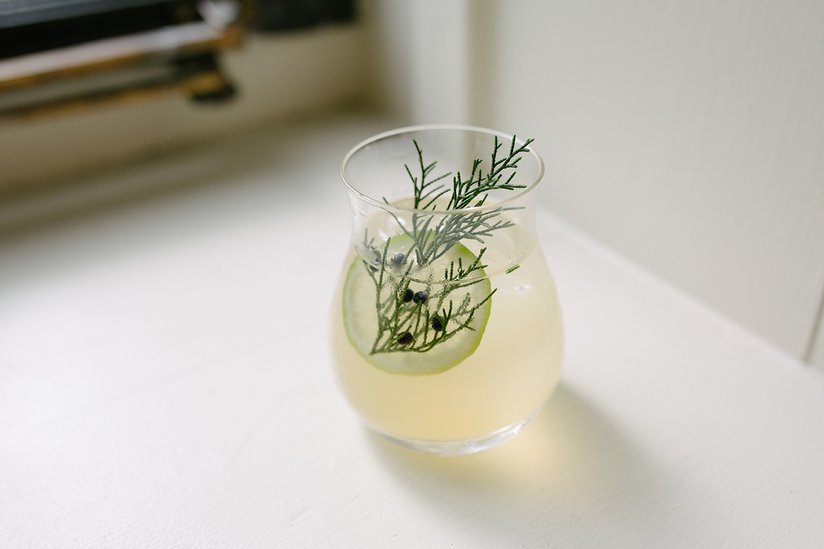 "J&T" which stands for Juniper and Tonic, a play on a Gin and Tonic, garnished with foraged juniper and lime wheel.